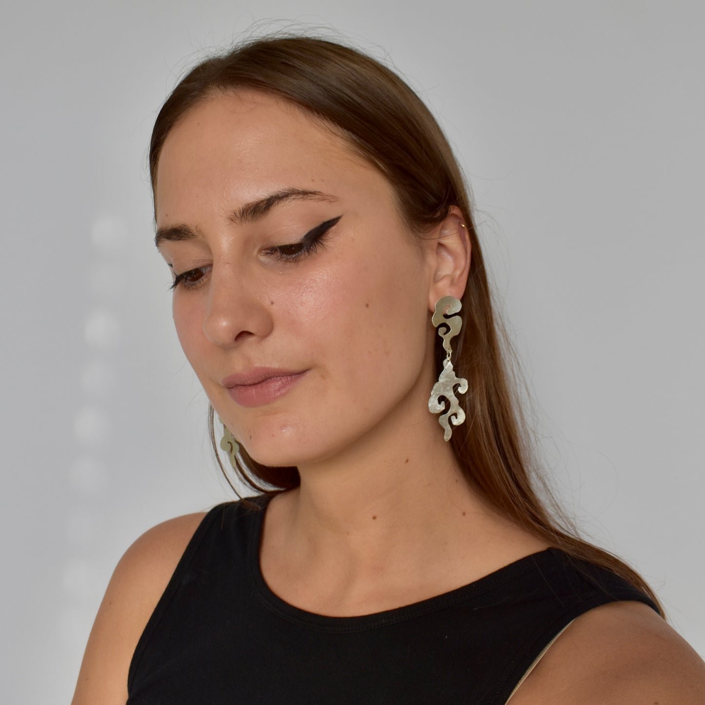 umo earrings in silver & brass